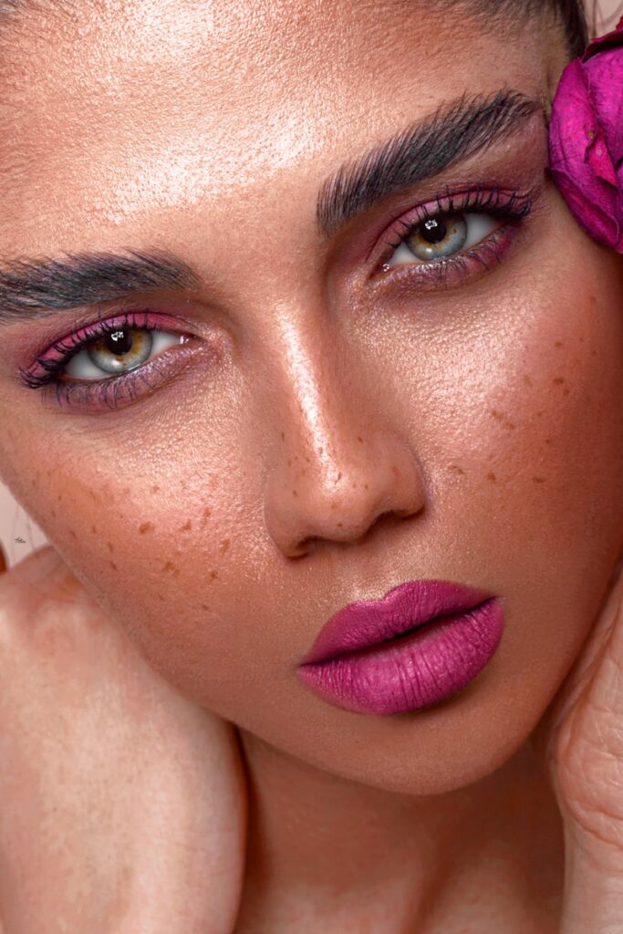 a close up of a woman with a flower in her hair